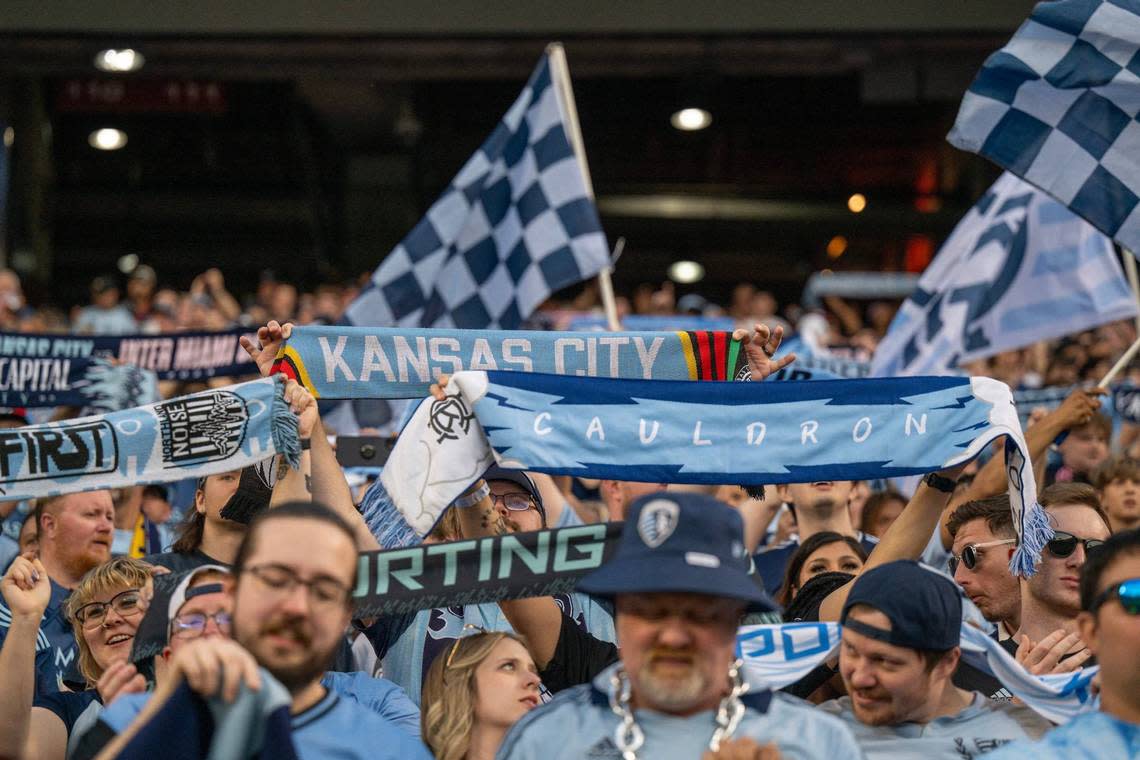 Fans hold up scarfs during an MLS game between Sporting Kansas City and Inter Miami at GEHA Field at Arrowhead Stadium on Saturday, April 13, 2024, in Kansas City. Emily Curiel/ecuriel@kcstar.com