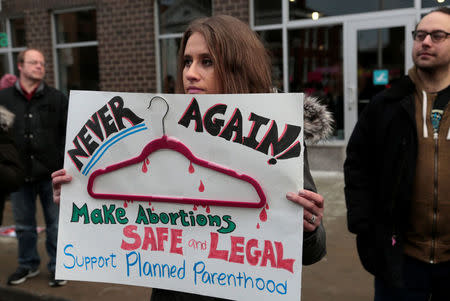 Supporters of Planned Parenthood rally outside a Planned Parenthood clinic in Detroit, Michigan, U.S. February 11, 2017. REUTERS/Rebecca Cook