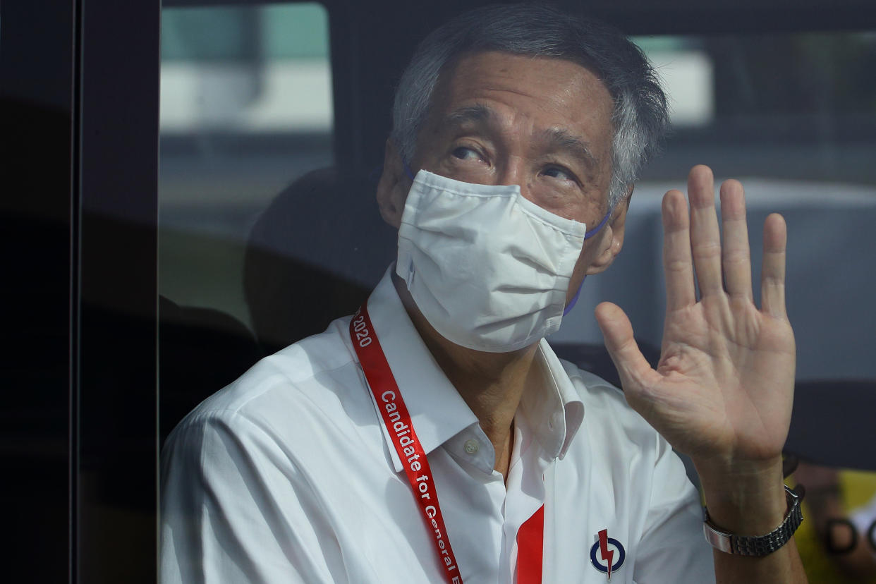 SINGAPORE - JULY 10:  People's Action Party Secretary-General and Singapore Prime Minister, Lee Hsien Loong waves as he leaves a polling centre during the general election on July 10, 2020 in Singapore. Singaporeans go to the polls today as the ruling party, People's Action Party seeks a fresh mandate amid the coronavirus (COVID-19) pandemic. As of July 9, the total number of COVID-19 cases in the country stands at 45,422.  (Photo by Suhaimi Abdullah/Getty Images)