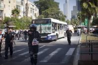 TEL AVIV, ISRAEL- NOVEMBER 21: Emergency services at the scene of an explosion on a bus with passengers onboard on November 21, 2012 in central Tel Aviv, Israel. At least ten people have been injured in a blast on a bus near military headquarters in what is being described as terrorist attack which threatens to derail ongoing cease-fire negotiations between Israeli and Palestinian authorities. (Photo by Ziv Oren/Getty Images)