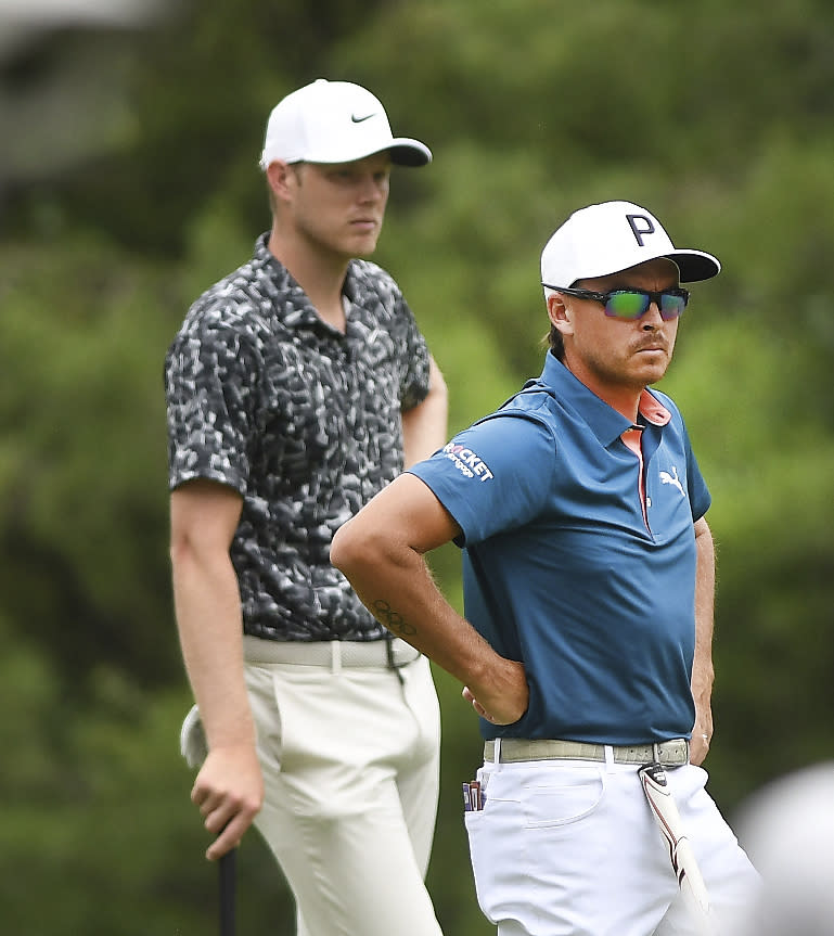 Cam Davis, left, and Rickie Fowler look over the eighth green during the second round of the Rocket Mortgage Classic golf tournament at the Detroit Golf Club in Detroit, Michigan, Friday, June 27, 2024. (Daniel Mears/Detroit News via AP)