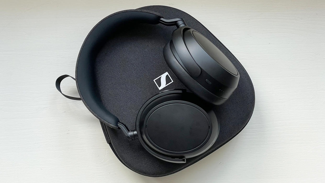  Listing image for best noise-cancelling headphones showing Sennheiser Momentum 4 Wireless headphones with case 