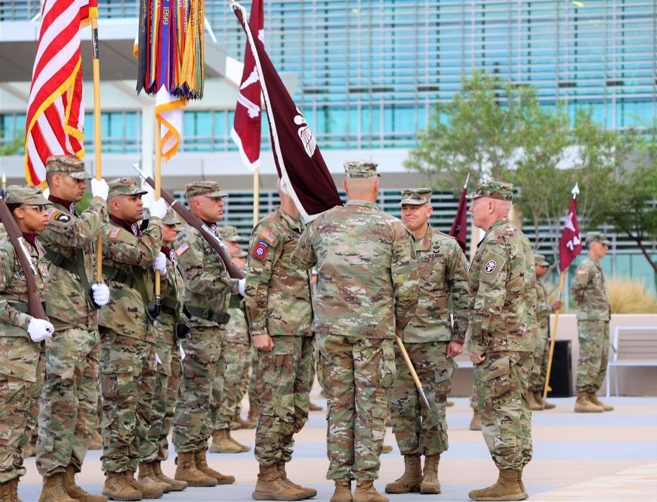 Army Col. Lee Freeman, back to camera, the new commander of William Beaumont Army Medical Center; Army Col. Brett Venable, middle, outgoing commander; and Army Brig. Gen. Darrin Cox, right, commanding general, Medical Readiness Command, West, take part in the change of command ceremony Thursday outside the Fort Bliss medical complex in East El Paso.