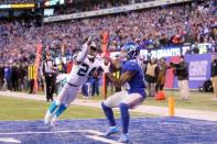 Dec 20, 2015; East Rutherford, NJ, USA; New York Giants wide receiver Odell Beckham Jr. (13) catches a touchdown pass in front of Carolina Panthers corner back Josh Norman (24) during the fourth quarter at MetLife Stadium. Mandatory Credit: Brad Penner-USA TODAY Sports