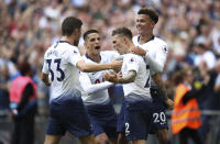 Tottenham Hotspur's Kieran Trippier, centre right, celebrates scoring his side's second goal of the game against Fulham during their English Premier League soccer match at Wembley Stadium in London, Saturday Aug. 18, 2018. (Nick Potts/PA via AP)