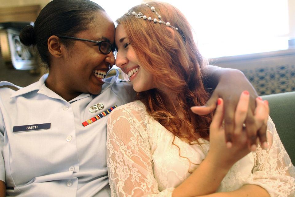 <p>U.S. Air Force Senior Airman Shyla Smith (left) and love Courtney Burdeshaw laugh while waiting to get married at the Manhattan Marriage Bureau the day after the U.S. Supreme Court's ruling on DOMA. The high court struck down the Defense of Marriage Act and ruled that supporters of California's ban on gay marriage, Proposition 8, could not defend it before the Supreme Court.</p>