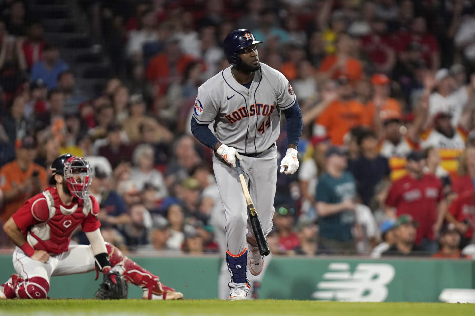 Houston Astros' Yordan Alvarez (44) watches the flight of his three-run home run as Boston Red Sox catcher Connor Wong, left, looks on in the sixth inning of a baseball game, Monday, Aug. 28, 2023, in Boston. (AP Photo/Steven Senne)