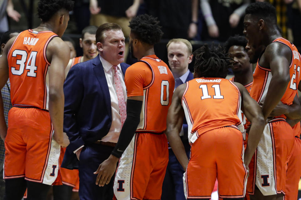 Illinois head coach Brad Underwood speaks with guard Alan Griffin (0) after being called for a foul during the first half of an NCAA college basketball game against Purdue in West Lafayette, Ind., Tuesday, Jan. 21, 2020. Griffin was ejected for the foul. (AP Photo/Michael Conroy)