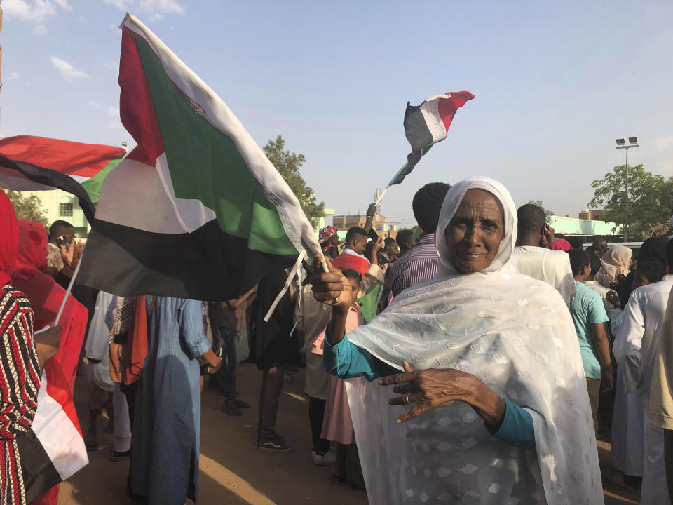 Sudanese people celebrate in the streets of Khartoum after ruling generals and protest leaders announced they have reached an agreement on the disputed issue of a new governing body on Friday, July 5, 2019. The deal raised hopes it will end a three-month political crisis that paralyzed the country and led to a violent crackdown that killed scores of protesters. (AP Photo)