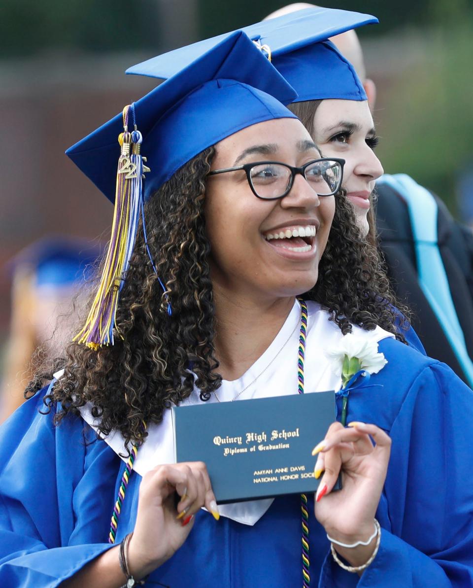 Amyah Davis, a National Honor Society member, with her diploma at Quincy High School graduation Tuesday, June 7, 2022.