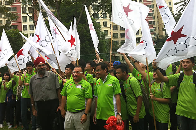 Desmond Lim standing alongside his supporters on the nomination day. (Yahoo! photo)