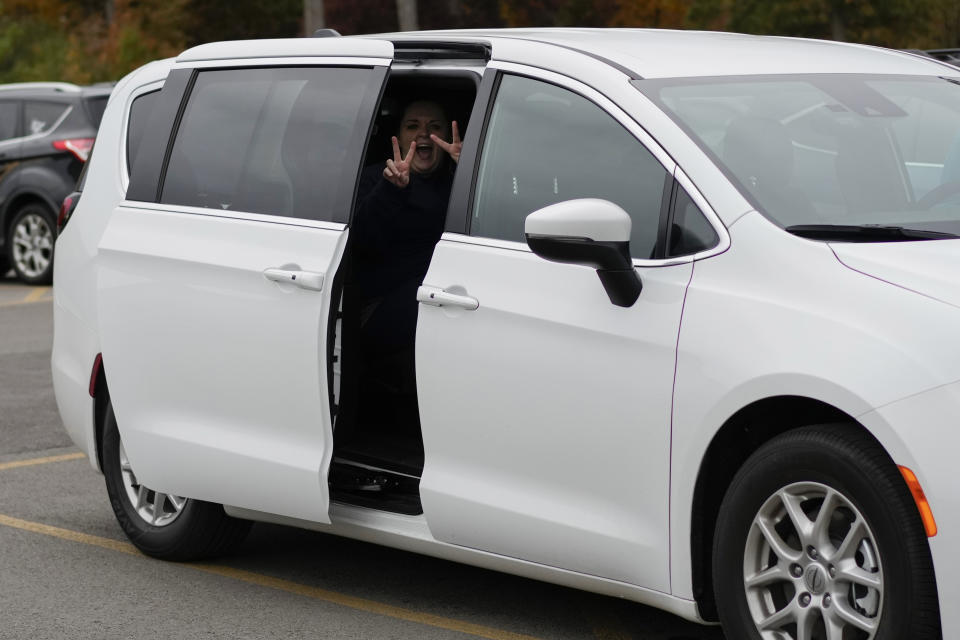 Heather Jarvis gestures smiling from a vehicle after being released from the Ohio Reformatory for Women, in Marysville, Ohio, Wednesday, Oct. 25, 2023. Jarvis is part of the fastest-growing prison population in the country, one of more than 190,000 women held in some form of confinement in the United States as of this year. Their numbers grew by more than 500% between 1980 and 2021. (AP Photo/Carolyn Kaster)