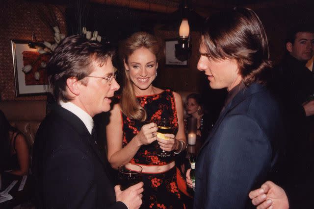 <p>Jeff Kravitz/FilmMagic</p> Michael J. Fox, Tracy Pollan and Tom Cruise in 2000