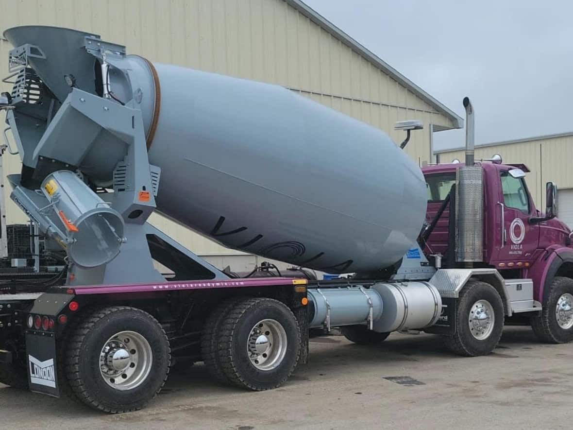 The concrete truck pictured above is from Viola, a major asphalt company that's headquartered in Markham, where the image was taken by an industry source and shared with CBC Toronto. Corporate records obtained by CBC Toronto show Viola and Infrastructure Management, one of the companies that won snow-clearing contracts with the city, are linked. Even if the companies weren't linked, the winning companies are allowed to subcontract out 25 per cent of the work. City staff did not dispute the plow in the image could be used.  (Submitted by Name withheld - image credit)