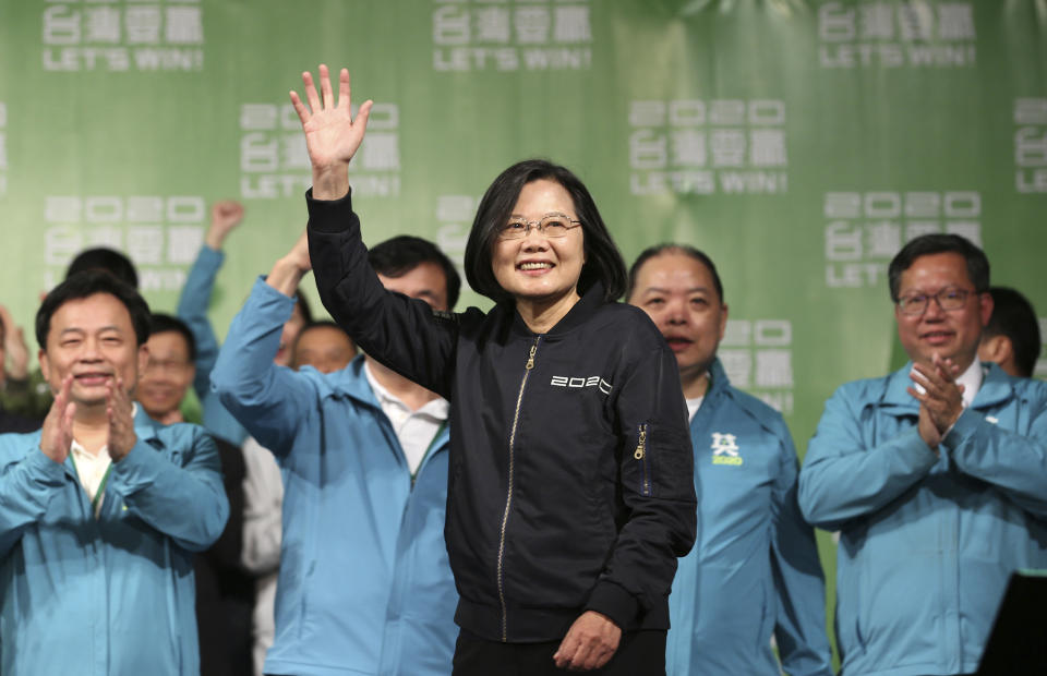 Taiwan's 2020 presidential election candidate, Taiwanese President Tsai Ing-wen celebrates her victory with supporters in Taipei, Taiwan, Saturday, Jan. 11, 2020.  Taiwan's independence-leaning President Tsai Ing-wen won a second term in a landslide election victory Saturday, signaling strong support for her tough stance against China. (AP Photo/Chiang Ying-ying)
