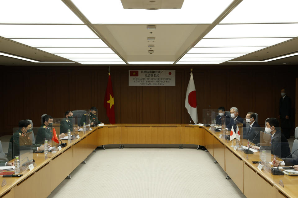 Vietnam's Defense Minister General Phan Van Giang, left, and Japan's Defense Minister Nobuo Kishi attend their bilateral meeting at the Defense Ministry in Tokyo, Tuesday, Nov. 23, 2021. (Issei Kato/Pool Photo via AP)