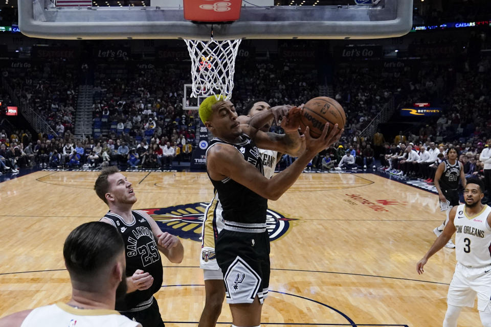 San Antonio Spurs forward Jeremy Sochan goes to the basket in the first half of an NBA basketball game against the New Orleans Pelicans in New Orleans, Thursday, Dec. 22, 2022. (AP Photo/Gerald Herbert)