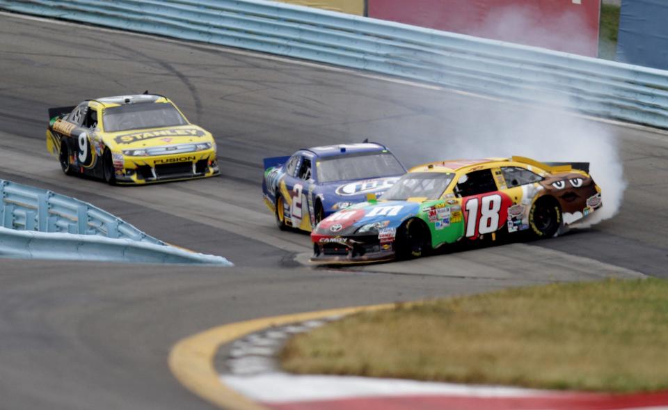Kyle Busch (18) is involved in an incident ahead of Brad Keselowski (2) and Marcos Ambrose during the NASCAR Cup Series race at Watkins Glen International in 2012.