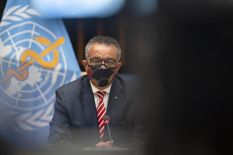 In this photo released by WHO, World Health Organisation on Monday, Oct. 5, 2020, WHO Director-General, Dr Tedros Adhanom Ghebreyesus, wearing a mask to protect against coronavirus, looks on, during a special session on the COVID-19 respnse. The head of emergencies at the World Health Organization says its “best estimates” indicate that roughly 1 in 10 people worldwide may have been infected by the coronavirus. (Christopher Black/WHO via AP)