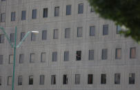 <p>An Iranian policeman looks out of the parliament’s building in central Tehran, Iran, June 7, 2017. (Photo: TIMA via Reuters) </p>