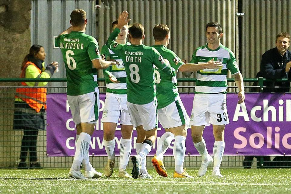 Yeovil Town's Chris Dagnall (right) celebrates scoring his side's third goal of the game with team mates during the FA Cup fourth qualifying round replay match at Coles Park Stadium, London. PA Photo. (PA)