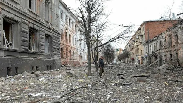 PHOTO: A pedestrian walks amid debris in a street following a shelling in Ukraine&#39;s second-biggest city of Kharkiv, March 7, 2022.  (Sergey Bobok/AFP via Getty Images)