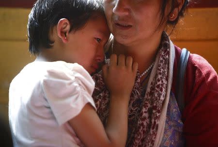 A child cries as family members mourn the deaths of Nepali mountaineering guides who were killed in Friday's avalanche on Mount Everest, at Sherpa Monastery in Kathmandu April 19, 2014. REUTERS/Navesh Chitrakar