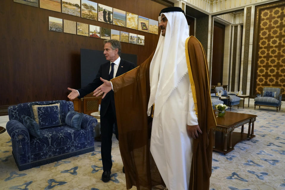 FILE - Secretary of State Antony Blinken, left, and Qatari Emir Sheikh Tamim bin Hamad Al Thani arrive for their meeting in Lusail, Qatar, Oct. 13, 2023. AP Washington photographer Jacquelyn Martin recalls how being one of a few female photographers covering news and politics was useful when she was assigned as the press pooler for Blinken's last-minute trip to Israel and the Middle East in the aftermath of the Hamas attacks. Martin said, “Sometimes people not knowing what to make of you works in your favor.” (AP Photo/Jacquelyn Martin, Pool, File)