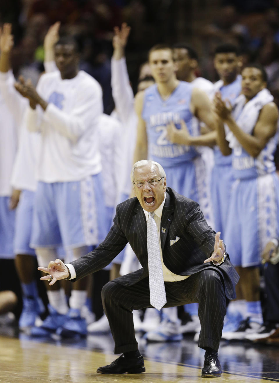 North Carolina head coach Roy Williams emotes on the sideline against Iowa State during the second half of a third-round game in the NCAA college basketball tournament Sunday, March 23, 2014, in San Antonio. (AP Photo/David J. Phillip)