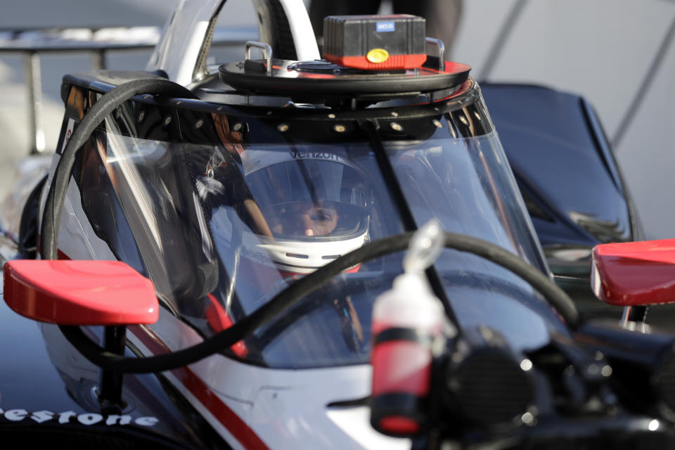 Will Power, of Australia, sits in his car during the Aeroscreen testing at Indianapolis Motor Speedway, Wednesday, Oct. 2, 2019, in Indianapolis. (AP Photo/Darron Cummings)