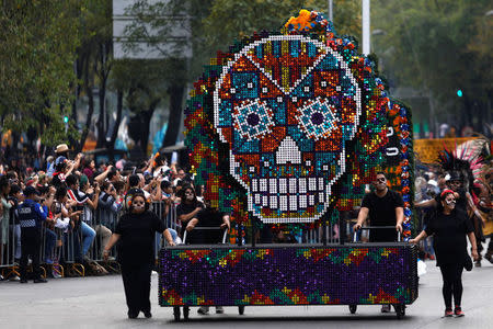 A float with a skull figure participates in a procession to commemorate Day of the Dead in Mexico City, Mexico, October 28, 2017. REUTERS/Edgard Garrido