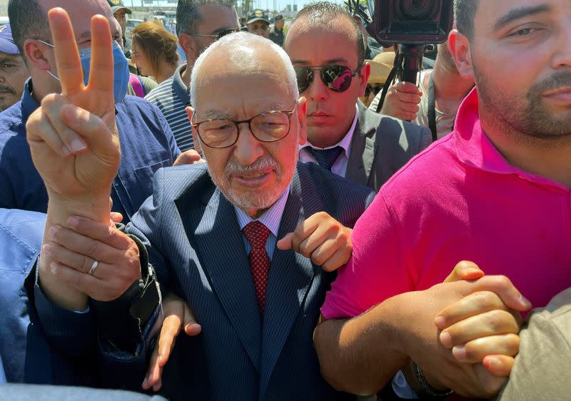 Tunisia's Islamist movement leader Rached Ghannouchi gestures upon arrival at court in Tunis