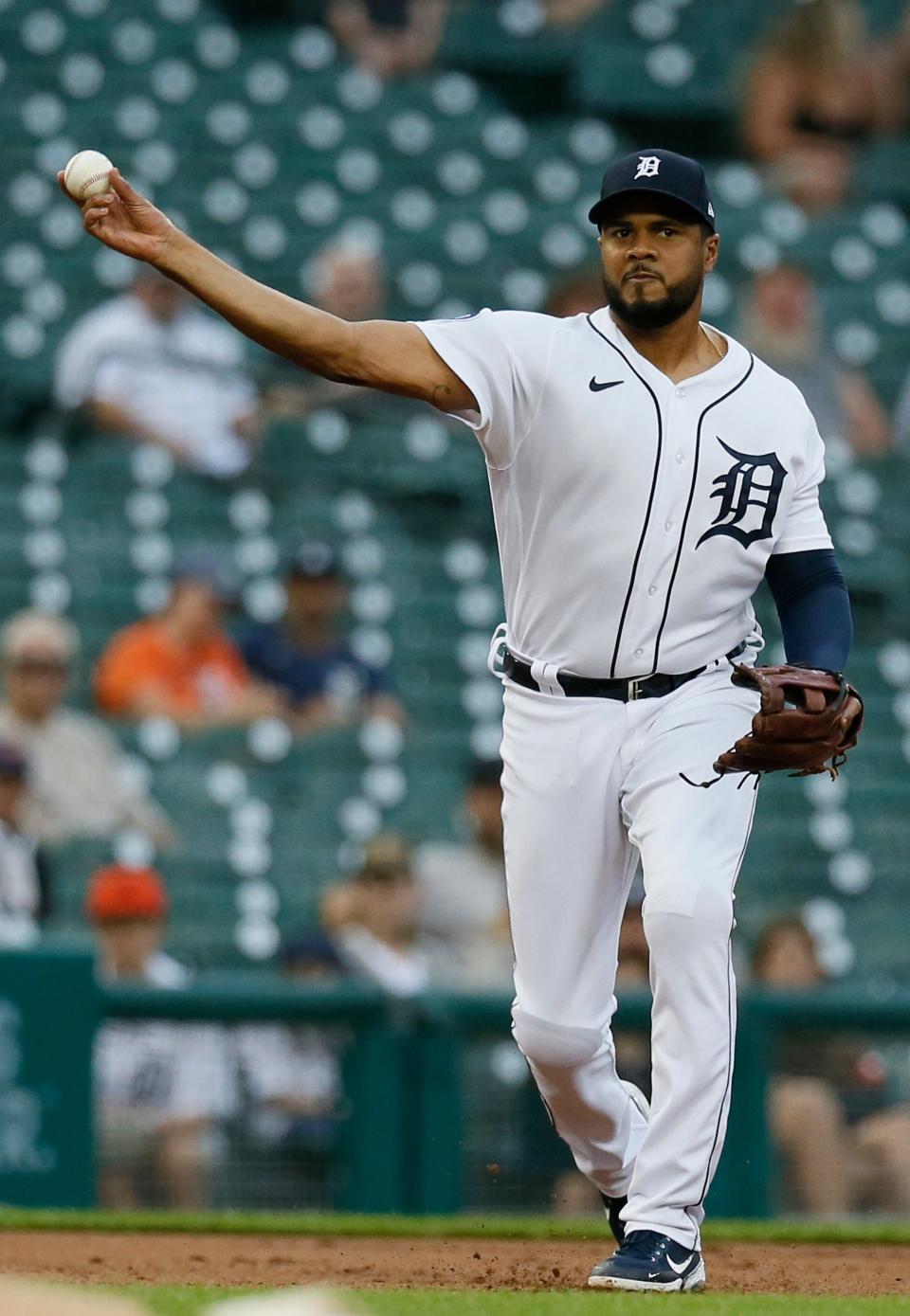 Tigers third baseman Jeimer Candelario throws out Mariners right fielder Mitch Haniger at first base during the first inning on Tuesday, Aug. 30, 2022, at Comerica Park.