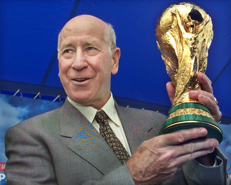 FILE PHOTO: FIFA AMBASSADOR AND ENGLAND SOCCER LEGEND BOBBY CHARLTON HOLDS UP FIFAWORLD CUP TROPHY IN YOKOHAMA.