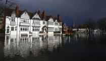 The river Thames floods the village of Datchet, southern England February 10, 2014. REUTERS/Eddie Keogh