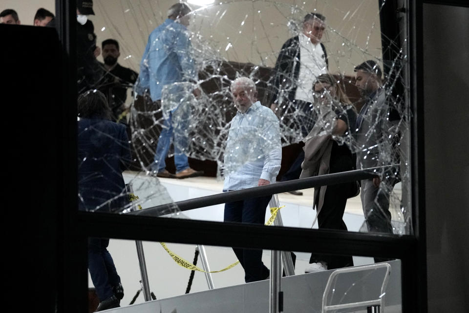 FILE - Brazil's President Luiz Inacio Lula da Silva surveys the damage of the Planalto presidential palace after it was stormed by supporters of former President Jair Bolsonaro, in Brasilia, Brazil, Jan. 8, 2023. (AP Photo/Eraldo Peres, File)