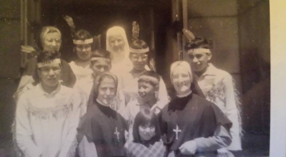 Evelyn Korkmaz, front and centre, with Sister Francoise Seguin, right, at St. Anne’s in Fort Albany before leaving for Expo 67 in Montreal. (Submitted by Evelyn Korkmaz - image credit)