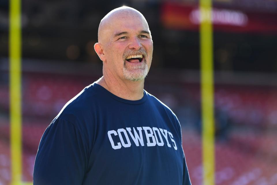 Dallas Cowboys defensive coordinator Dan Quinn looks on during pre-game warm-ups before a game against Washington.