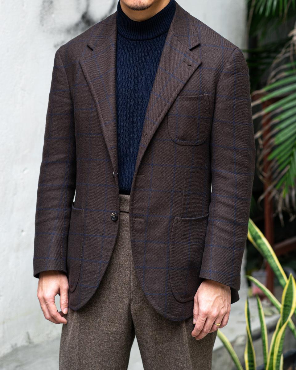 A single-breasted sport coat with casual patch pockets.