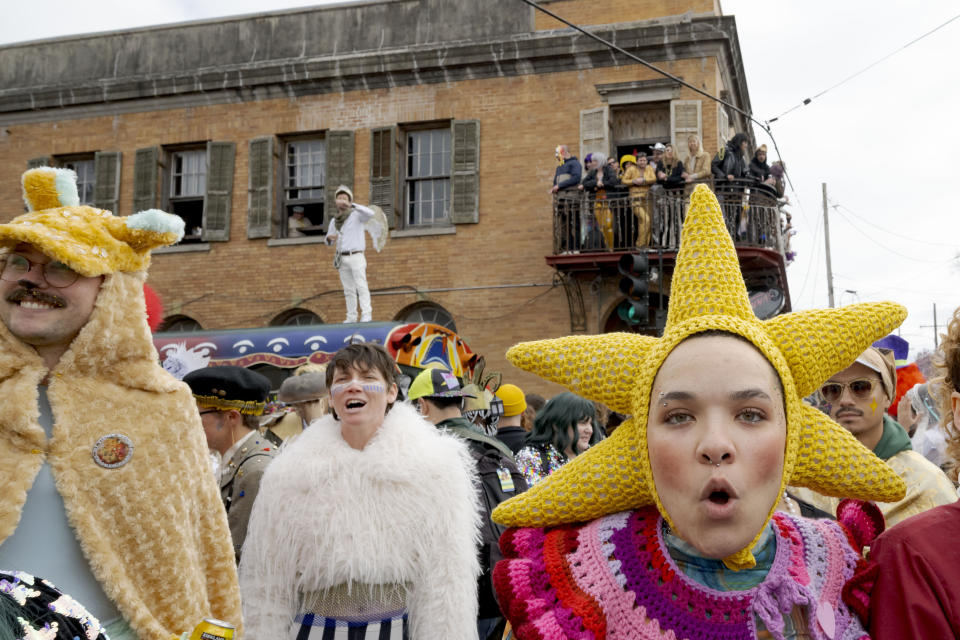 People walk in costumes during the Society of Saint Anne parade through Bywater and Marigny neighborhoods on Mardi Gras Day in New Orleans, Tuesday, Feb. 13, 2024. (AP Photo/Matthew Hinton)