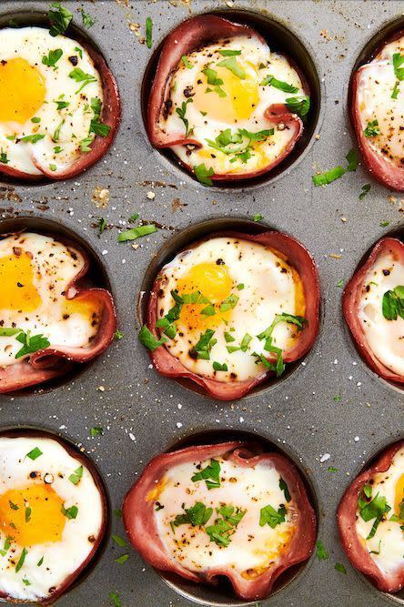 <p>This low-carb breakfast comes together in no time—seriously, you only need 20-ish minutes! If you like your eggs super runny, you might want to pull them from the oven a minute before you think they're ready. You'll need to let them rest for a bit in the muffin tin before taking them out (they'll be HOT), and during these few minutes, the eggs will continue to cook slightly.</p><p>Get the <a href="https://www.delish.com/uk/cooking/recipes/a29030029/ham-cheese-egg-cups-recipe/" rel="nofollow noopener" target="_blank" data-ylk="slk:Ham & Cheese Egg Cups;elm:context_link;itc:0;sec:content-canvas" class="link ">Ham & Cheese Egg Cups</a> recipe.</p>
