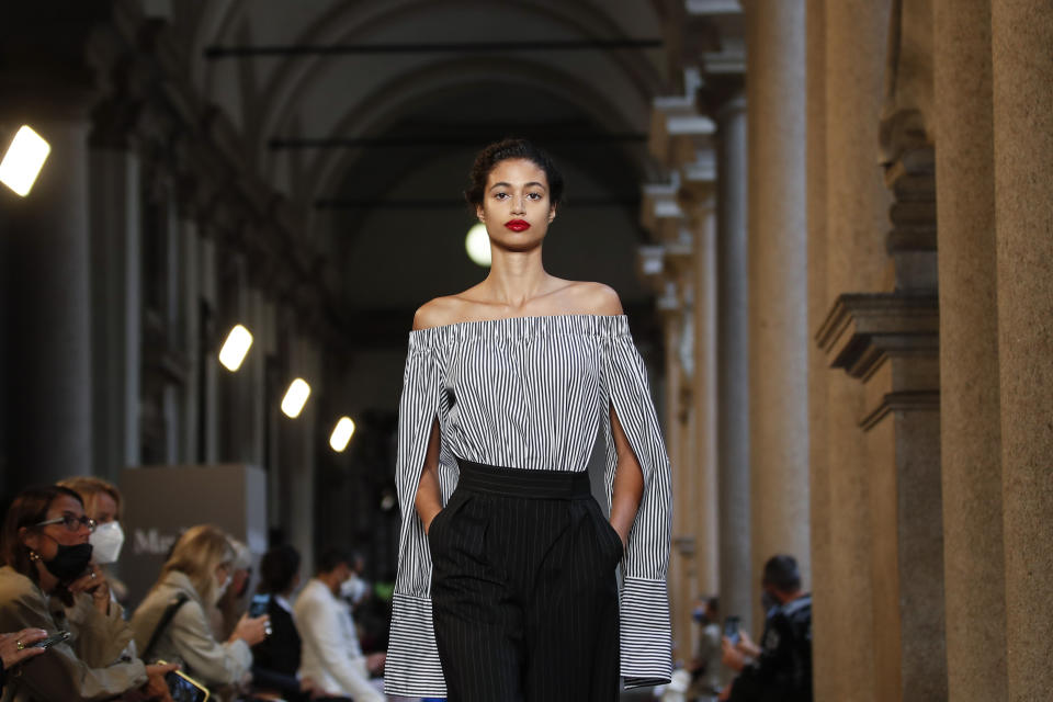 A model wears a creation as part of the Max Mara 2021 women's spring-summer ready-to-wear collection during the Milan's fashion week in Milan, Italy, Thursday, Sept. 24, 2020. (AP Photo/Antonio Calanni)