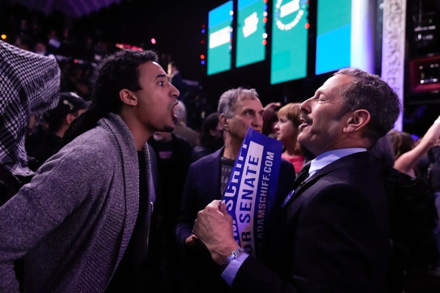 A Pro-Palestinian demonstrator, left, yells at a supporter of U.S. Rep. Adam Schiff, D-Calif., a U.S Senate candidate, during Schiff’s election night party, Tuesday, March 5, 2024, in Los Angeles. (AP Photo/Jae C. Hong)