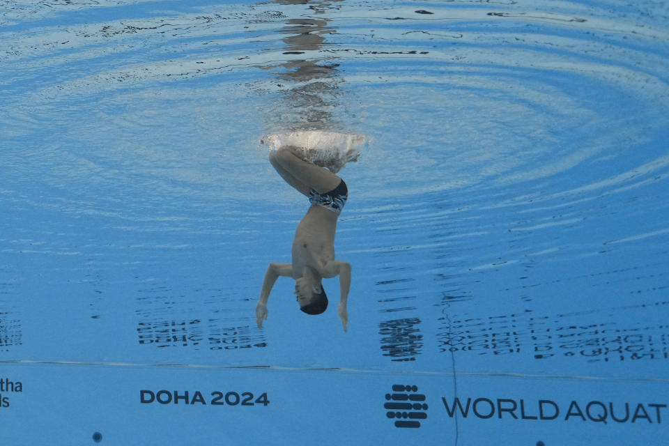 Yang Shuncheng of China competes in the men's solo technical final of artistic swimming at the World Aquatics Championships in Doha, Qatar, Monday, Feb. 5, 2024. (AP Photo/Lee Jin-man)