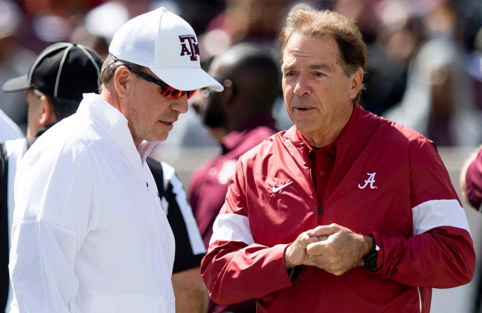 Texas A&M head coach Jimbo Fisher and Alabama head coach Nick Saban chat at midfield before their game at Kyle Field in College Station, Texas on Saturday October 12, 2019.