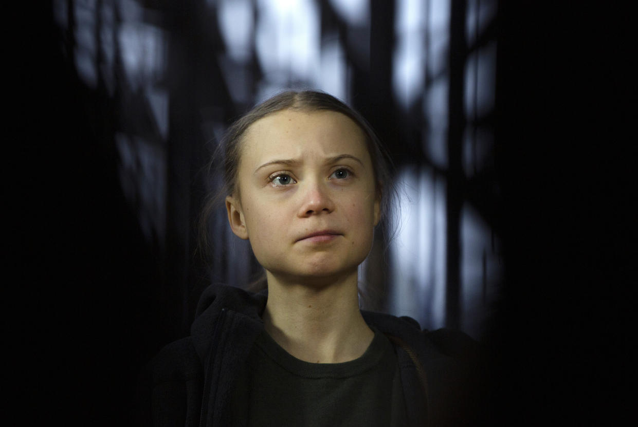 Swedish climate activist Greta Thunberg speaks with the media as she arrives for a meeting of the Environment Council at the European Council building in Brussels, Thursday, March 5, 2020. (AP Photo/Virginia Mayo)