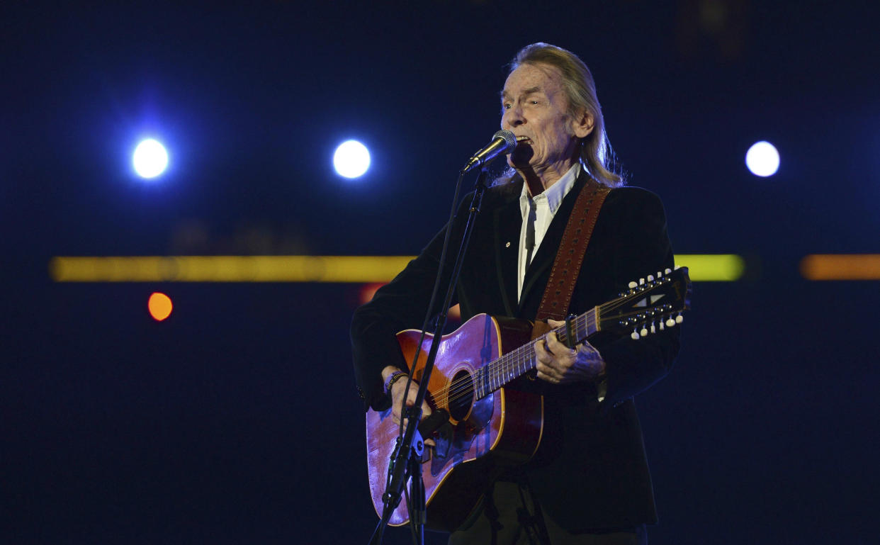 FILE - Gordon Lightfoot performs during the half-time show at the CFL Grey Cup championship football game between the Toronto Argonauts and the Calgary Stampeders on Nov. 25, 2012, in Toronto. Canada's legendary folk singer-songwriter, whose hits include “Early Morning Rain” and “The Wreck of the Edmund Fitzgerald," died on Monday, May 1, 2023, at a Toronto hospital, a representative of his family said. He was 84. (Sean Kilpatrick/The Canadian Press via AP)