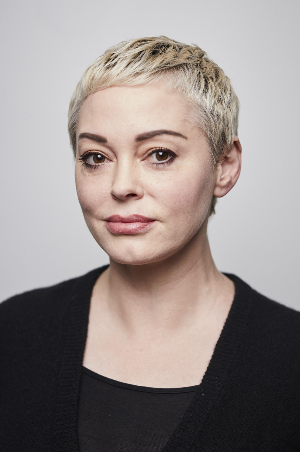 Rose McGowan poses for a portrait in New York on Friday, Jan. 3, 2020. McGowan doesn't plan be in the courtroom when Harvey Weinstein's sexual misconduct trial starts next week: One of Weinstein's most prominent accusers, McGowan says the trauma the fallen Hollywood mogul caused her is so great she couldn't bear the pain of it. McGowan has accused Weinstein of raping her more than 20 years ago and destroying her career; Weinstein has denied her claims. Since the allegations against Weinstein sparked the #MeToo movement, she has emerged as a vigorous advocate for sexual assault victims.(Photo by Matt Licari/Invision/AP)