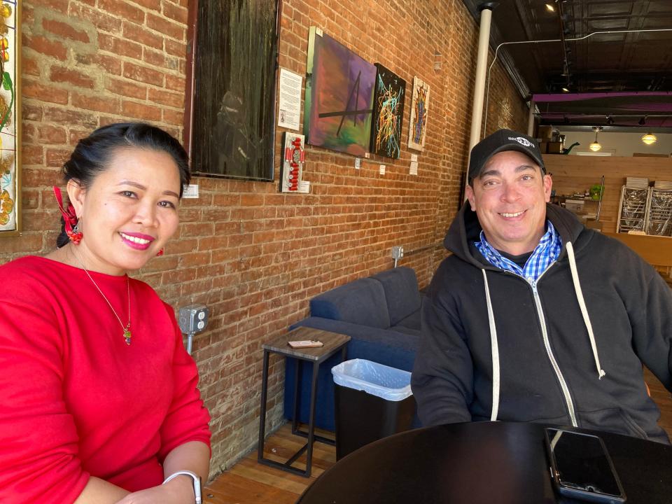 Joy Crossett, left, and Rauli Fernandez, co-owners of Rabble-Rouser Chocolate & Craft Co., sit inside the Montpelier cafe Nov. 3, 2023.