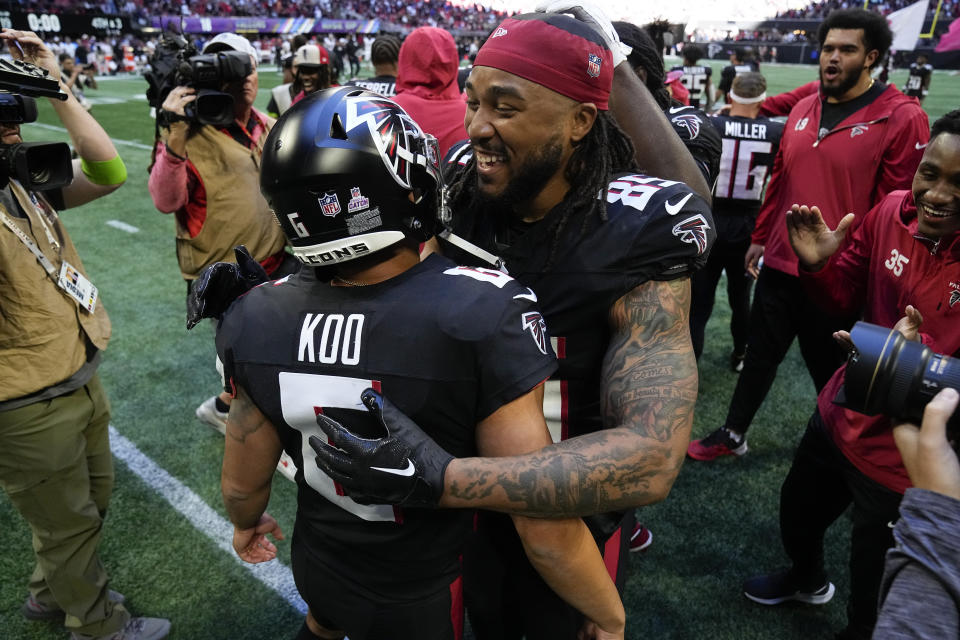 Atlanta Falcons place-kicker Younghoe Koo, left, celebrates with Atlanta Falcons tight end MyCole Pruitt, right, after an NFL football game against the Houston Texans in Atlanta, Sunday, Oct. 8, 2023. (AP Photo/John Bazemore)